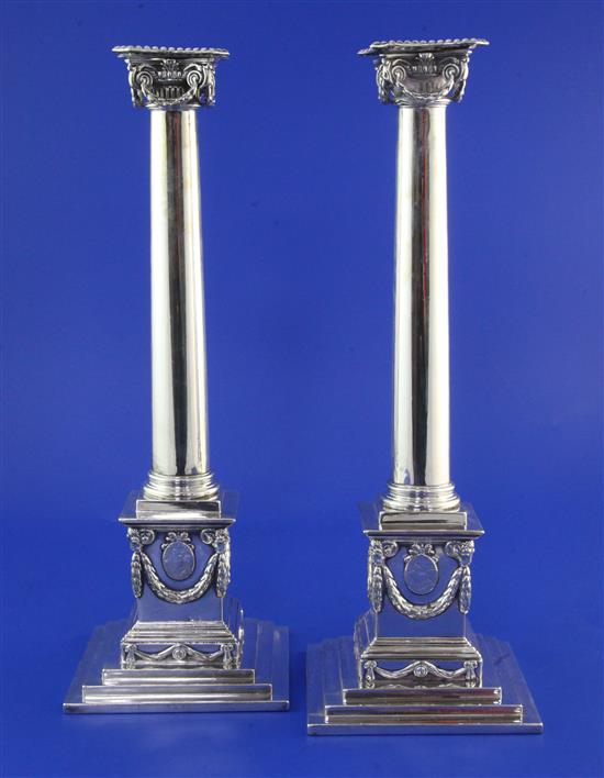 A good pair of George III silver ionic column candlesticks by John Cox, weighted.